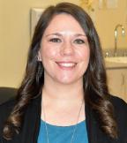 Head and shoulders image of lab staff member with long brown hair